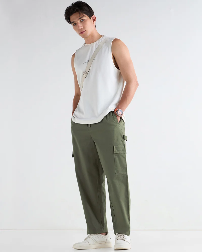 Bewakoof  Men's Dusty Olive Green Oversized Cargo Carpenter Pants for Men | Best Price UAE